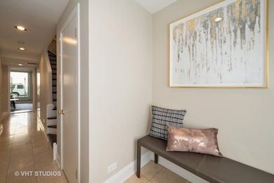 Marble Foyer with sizable coat closet leading to 3