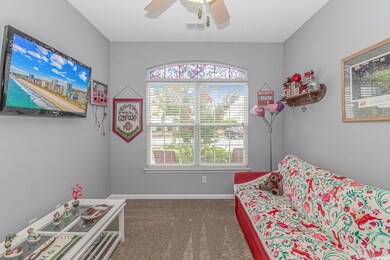 Sitting room featuring carpet floors and ceiling f
