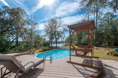 Pool and deck with view of lake