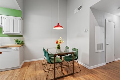 Dining room with light wood-style floors and base
