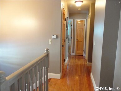 Other. Hallway with hardwood floors & 6 panel door