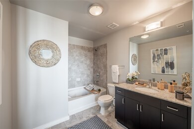 The second bath also includes a walk-in shower/tub