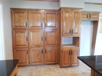 Wall of pantry cabinets with convenient space for
