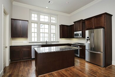 Kitchen is full of natural light.  Pantry to left.