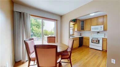 Dining room and kitchen, with sliders to the 2-lev