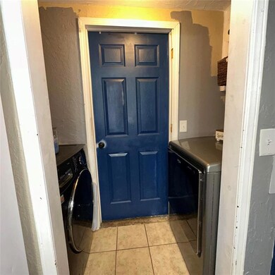 Clothes washing area with washer and dryer and lig
