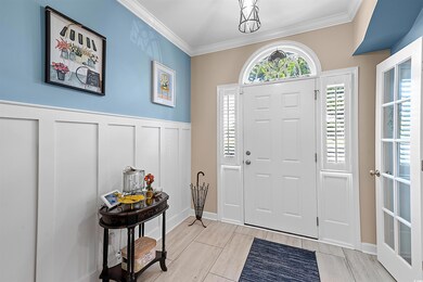 Beautiful Foyer with custom moldings.