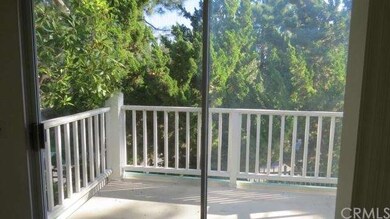 Spacious deck off living room with serene tree top