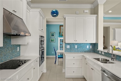 Well-designed kitchen with beautiful backsplash, w