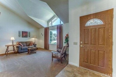 TILED ENTRY OPENS TO LIVING ROOM