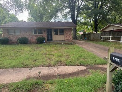 Ranch-style home with a front lawn