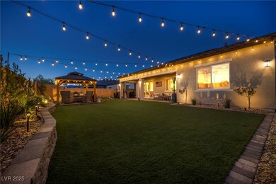 Yard at twilight with a patio, a gazebo, and fence