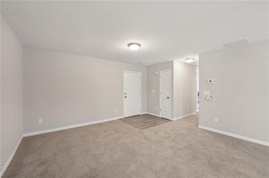 Unfurnished room with carpet flooring, baseboards,