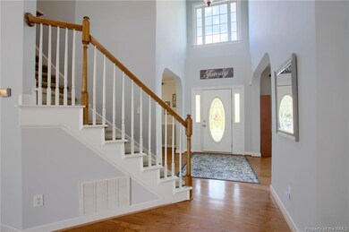 Hardwood floors great you as you enter the home.