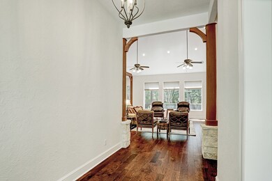 Opening the front door, the wood floors draw the eye to the main living space.