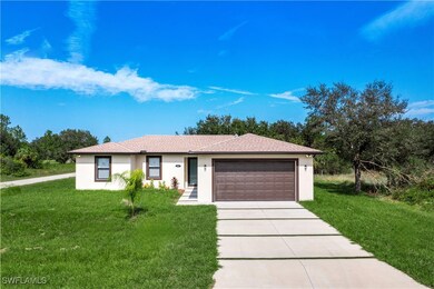 Single story home featuring a garage, stucco sidin