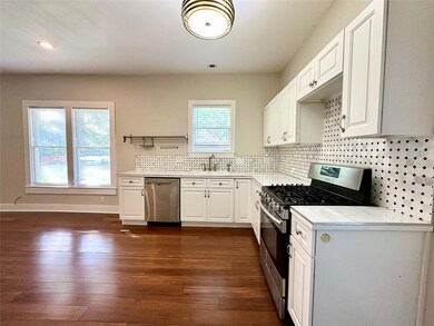 Kitchen featuring stainless steel appliances, lig