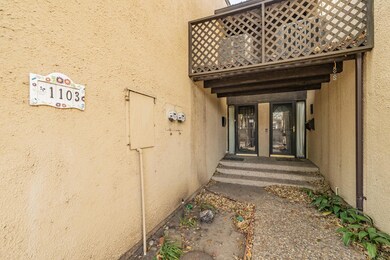 Entrance to property featuring a balcony and stucc
