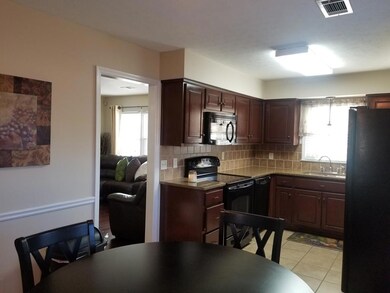 Eat in kitchen has TILE FLOOR.