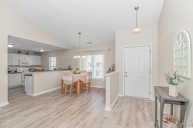 Foyer featuring light wood finished floors, a nota