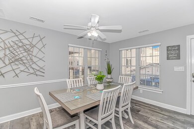 Dining area with hardwood / wood-style floors and 