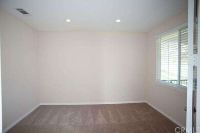 Downstairs room with double doors.