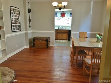 large dining room with hardwood floors and built-i