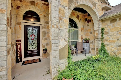 Property entrance featuring stone siding