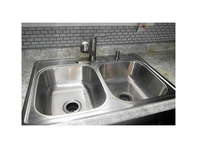 Kitchen. New stainless steel sink and faucet