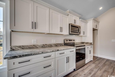 Kitchen featuring hardwood / wood-style flooring, 