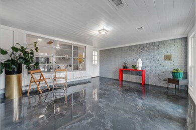 This Sun Room has epoxy flooring, It could be the work out room, or meditation room or gathering