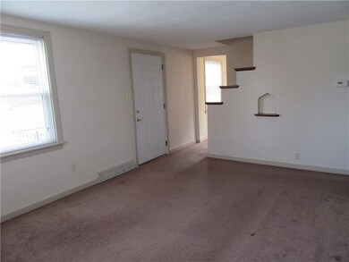 Living room with large window allowing natural lig