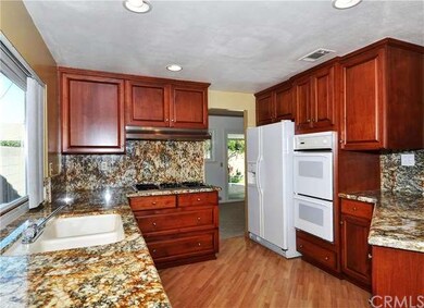 Gorgeous kitchen upgraded with custom wood cabinet