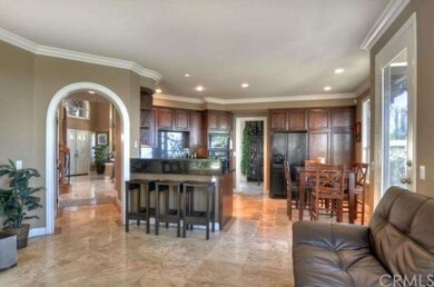 Spacious and elegant family room extends from the 