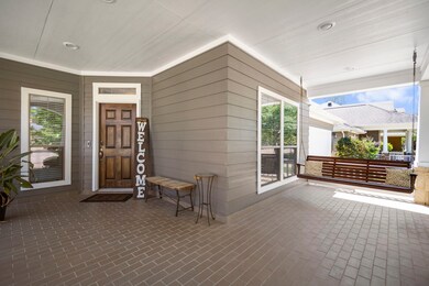 The front exterior features 2022 roof replacement, fresh paint via 2022 with a double-wide driveway and inviting front porch that leads you into the entry way.