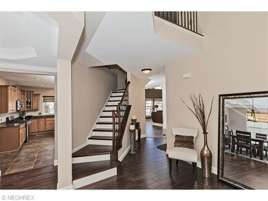 Gorgeous wood and iron wrought staircase leads to 