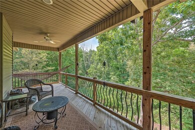 Main floor covered deck overlooking beautiful scenery bike trails just beyond the trees