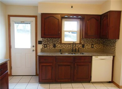 Another view of the kitchen leading to the trex de
