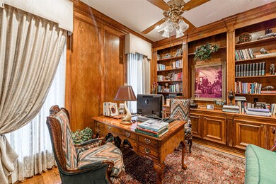 The study is just off the foyer with beautiful woo