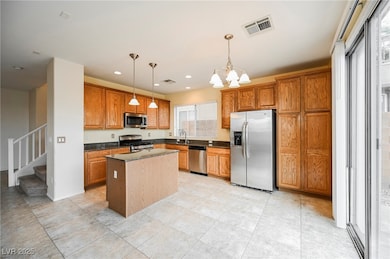 Kitchen featuring appliances with stainless steel