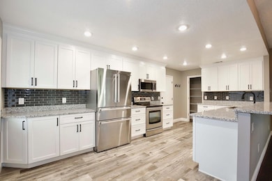 Kitchen with granite counterto9ps