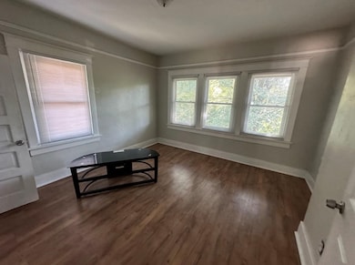 Dining room with dark wood-type flooring