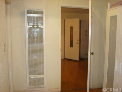 Spacious hallway, laminate wood flooring connect w