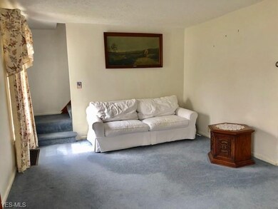 other end of living room leading to upstairs