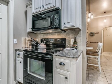 Kitchen-- The kitchen opens to the living and dini