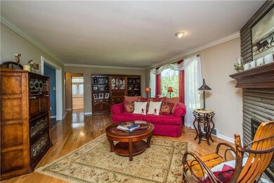 Oak hardwood floors line the large living room flo