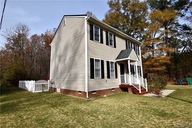 View of home's exterior with a lawn