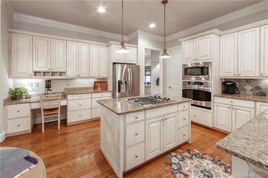 Gas downdraft cooktop and loads of cabinetry.