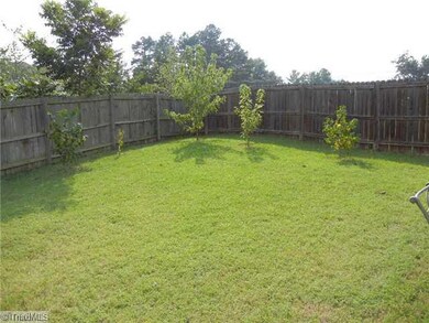 Yard/Garden. Large privacy fenced yard. Yard extends 20+ feet byond the fenced and the lovely trees on the other side of the fence belong to this property.