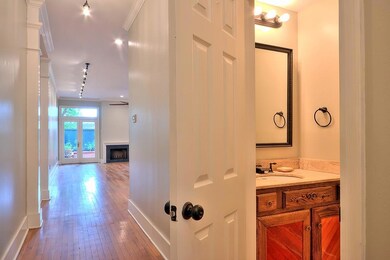Hallway with powder room downstairs